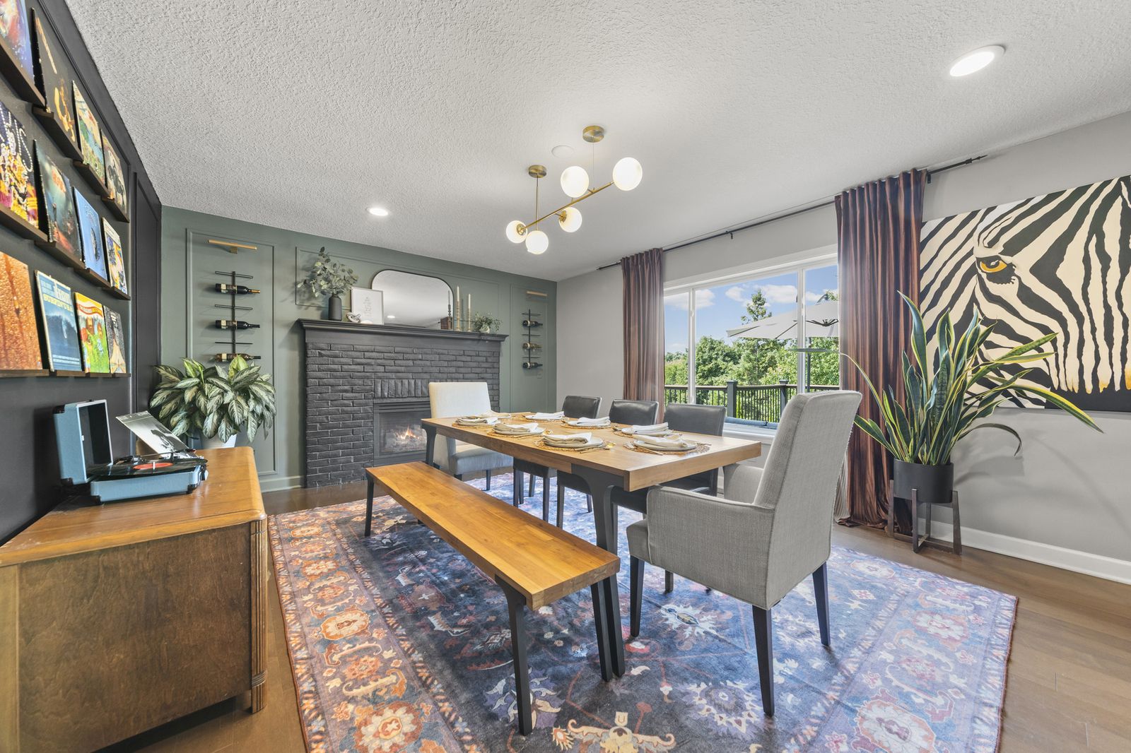 Dining room with dark accent wall and built-in shelving