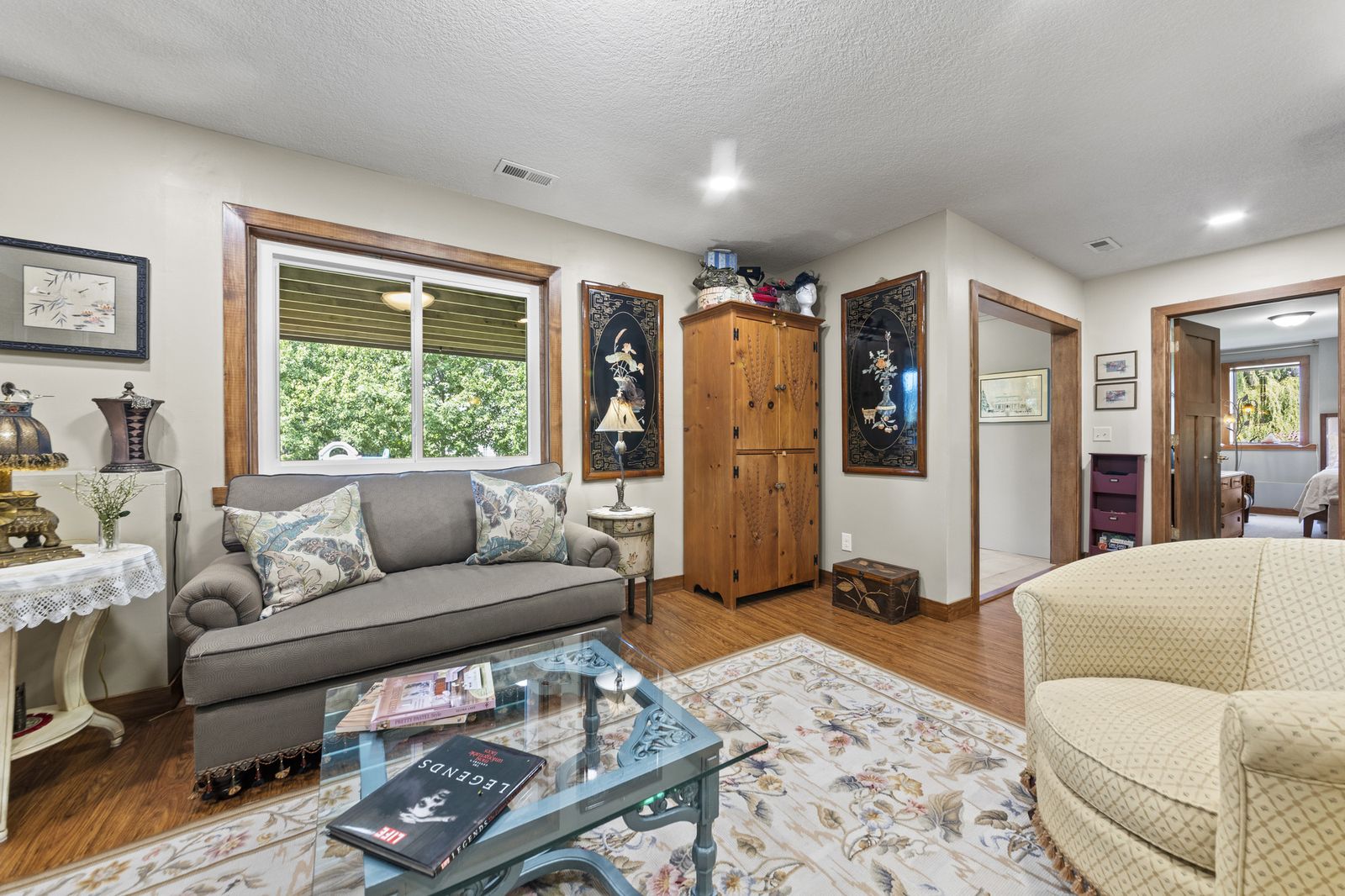 Living room with large windows and sofas