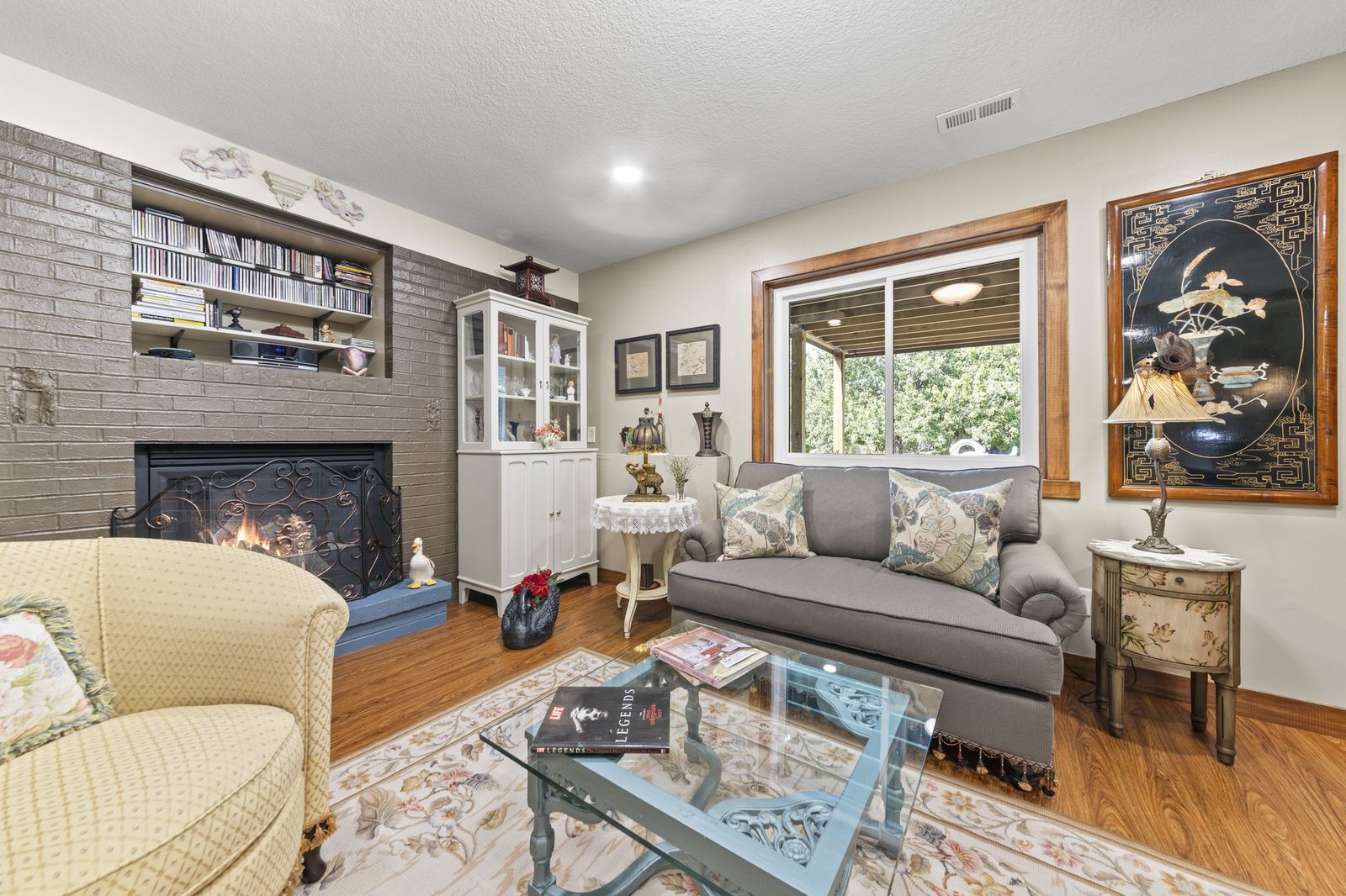 Living room with fireplace and built-in shelving