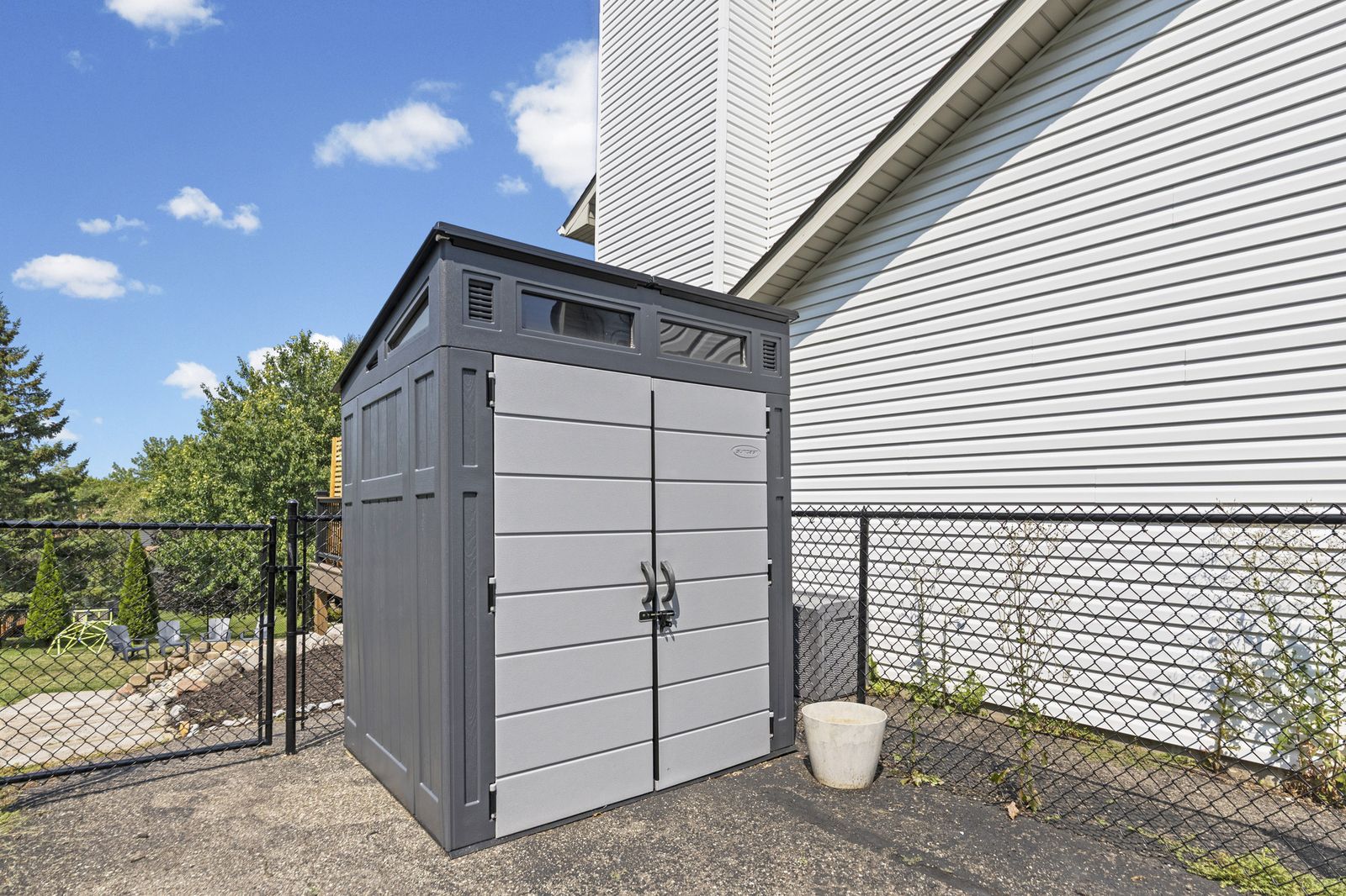 Storage shed on side of house