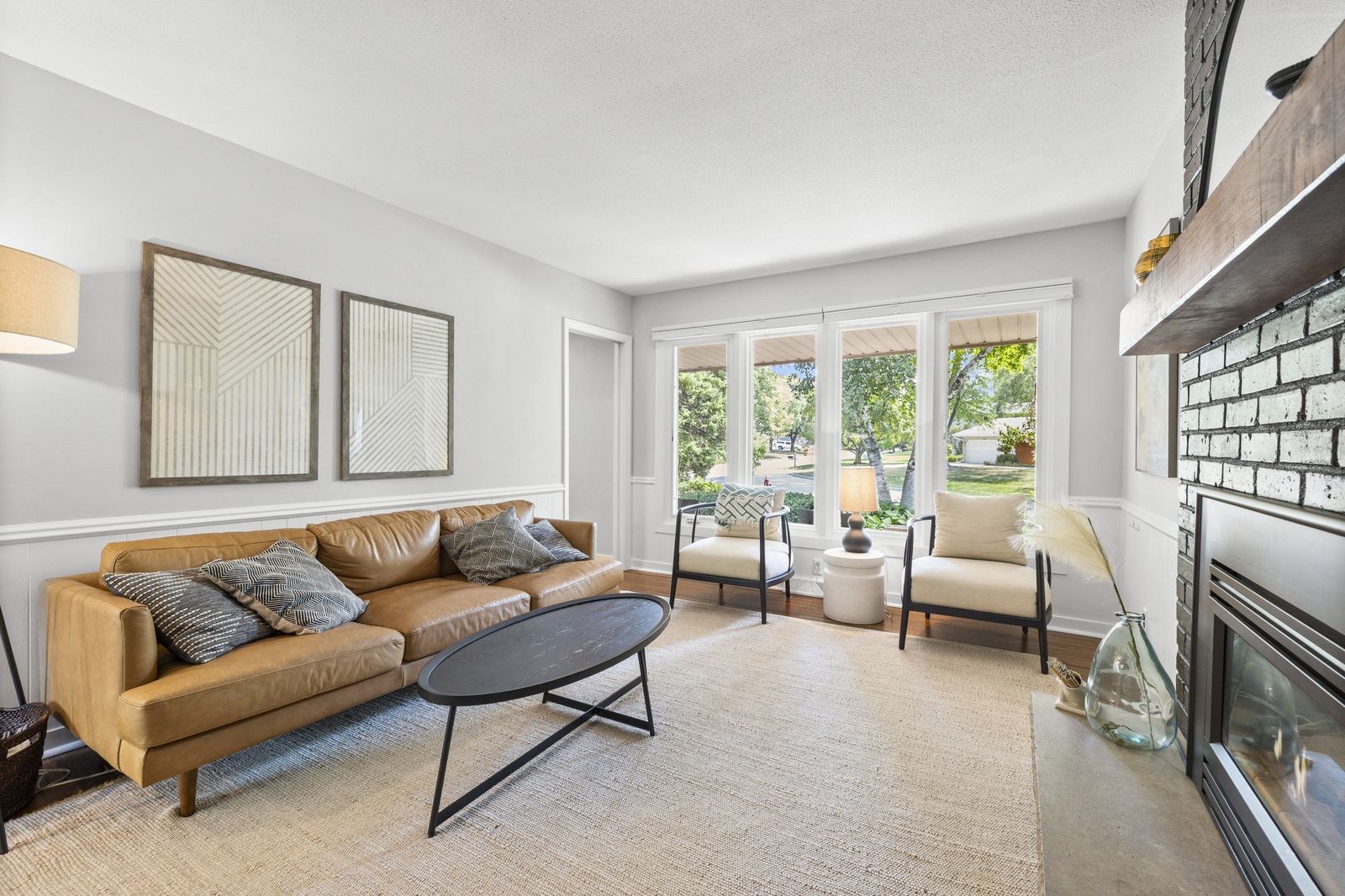 Living room with large windows and gallery wall
