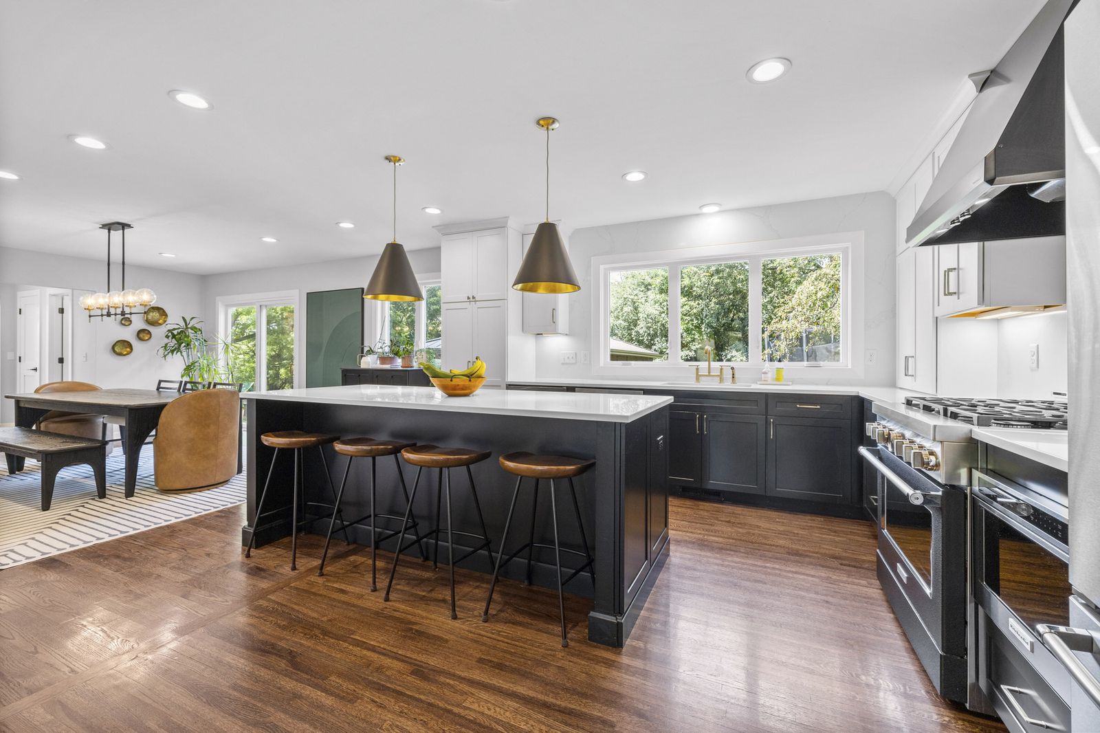 Kitchen with black cabinetry and gas range