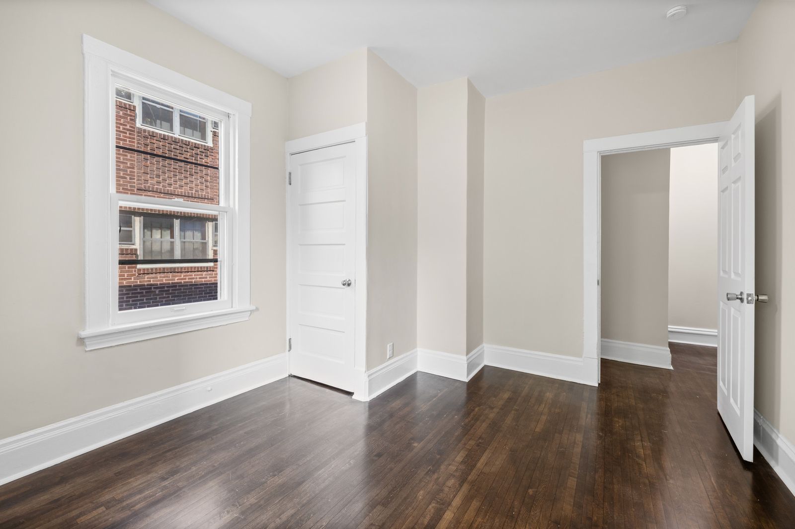 Empty upstairs room with hardwood floors