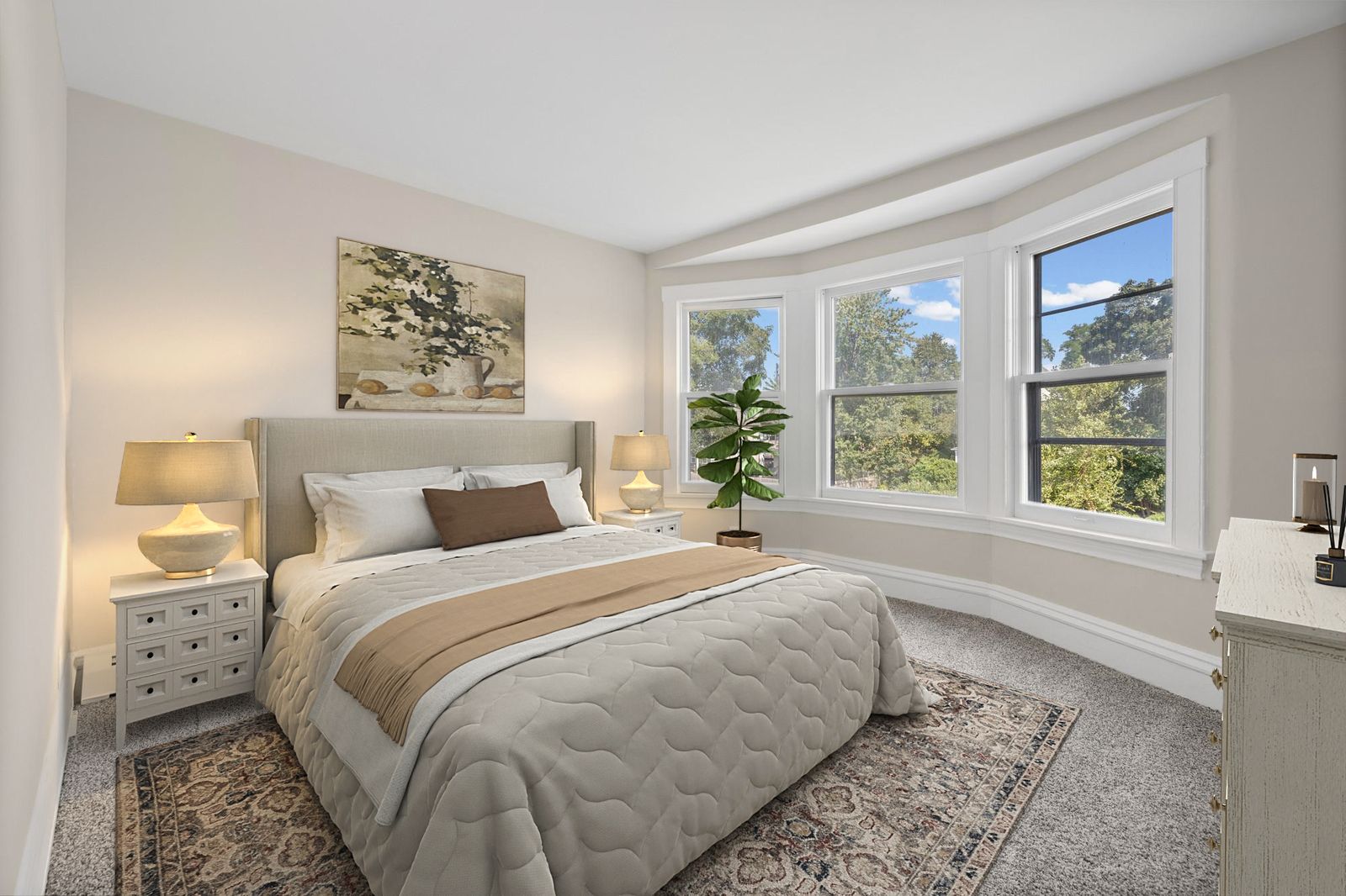 Upstairs bedroom with bay window and bed