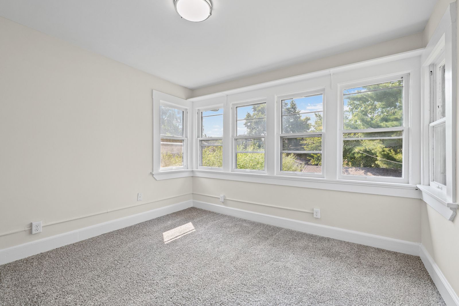 Upstairs bedroom with large bay window